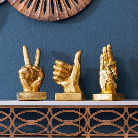 Promising review: "Super cute and quirky. I placed these on a mirrored shelf. They are great conversation pieces without being too awkward. Lightweight and the gold tone is beautiful. Great value in getting three pieces for one low price!" —KayePrice: $41.73 (for the set of three) / Available in gold (pictured) and silver.