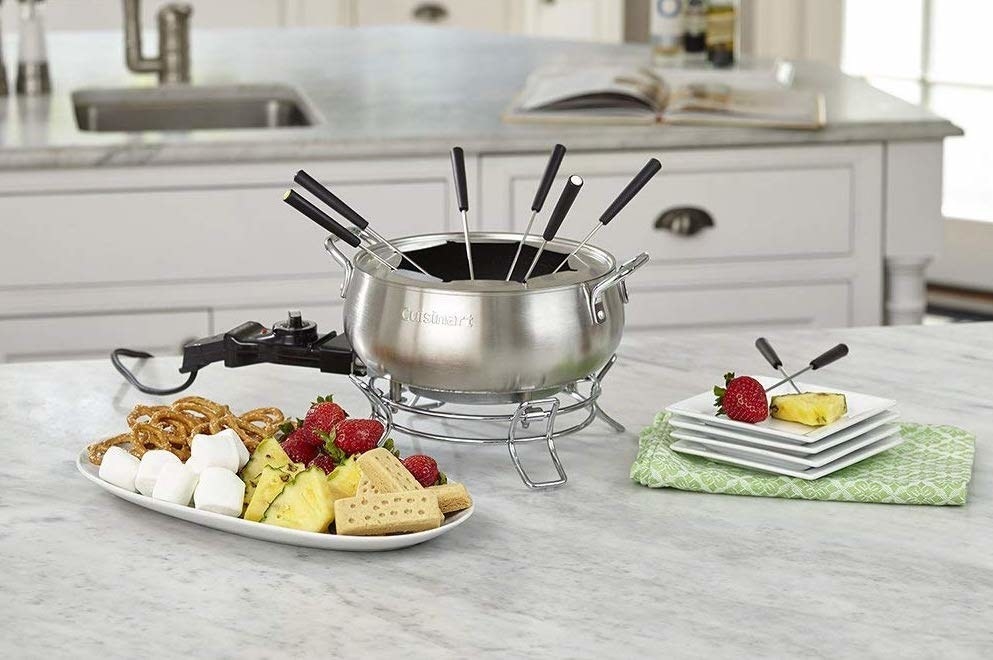 It's ok, just let the lyrics spill out. Swaggy.Promising review: "My boyfriend and I had a great time with this fondue pot on Valentine's Day. We had bread and veggies in a beer cheese, steak, shrimp, and chicken in a Cuban broth, and then desserts in marshmallow and melted chocolate (all recipes found online that are like The Melting Pot). This pot did not burn anything. When things started to bubble, we turned it down and gave it a swirl with a spoon. Nothing got stuck to the sides. It worked PERFECTLY. The cord does come detached sort of easily so be close to an outlet so it doesn't pop out on accident. We had so much fun and will be doing this again. This is the best fondue pot I've had yet." —SarahGet it from Amazon for $45.99.