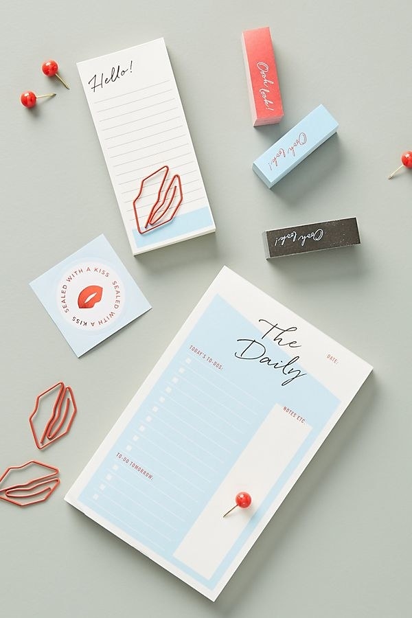The set includes twenty-four push pins, five lip-shaped paper clips, ten metallic stickers, one small notepad, one large notepad, and three packs of sticky tabs.Get it from Anthropologie for $22.