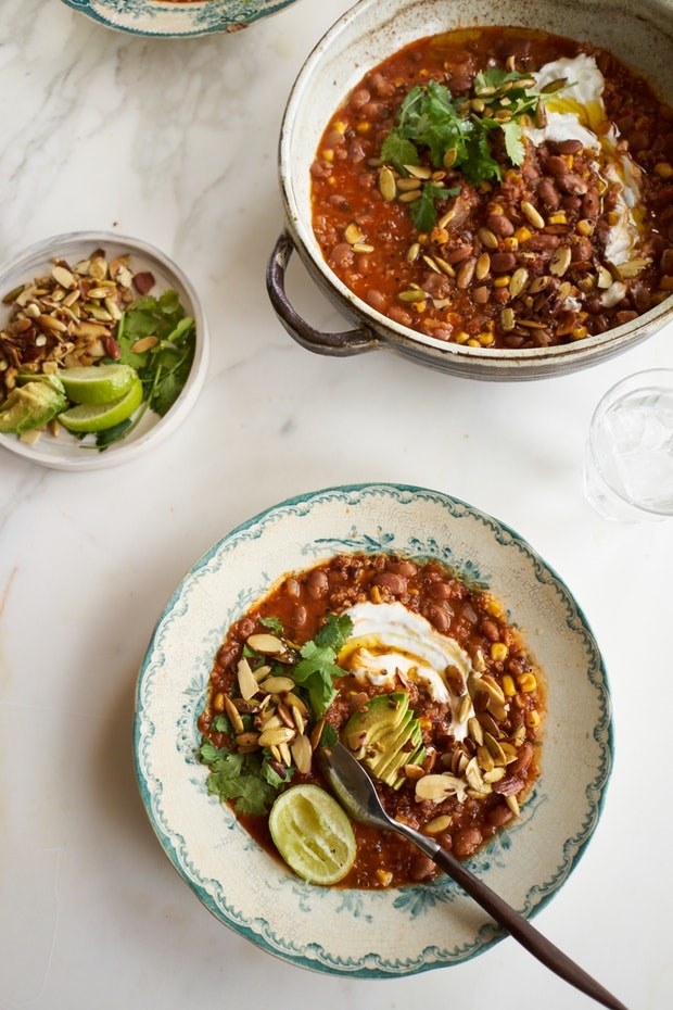On those nights when you only have the energy to chop a single onion, this zesty soup can be your fairy god-dinner. It's a simple, dump-and-stir kind of dish, filled with flavor from red salsa, taco seasoning, garlic, avocado, and some toasted pepitas on top. Get the recipe here.