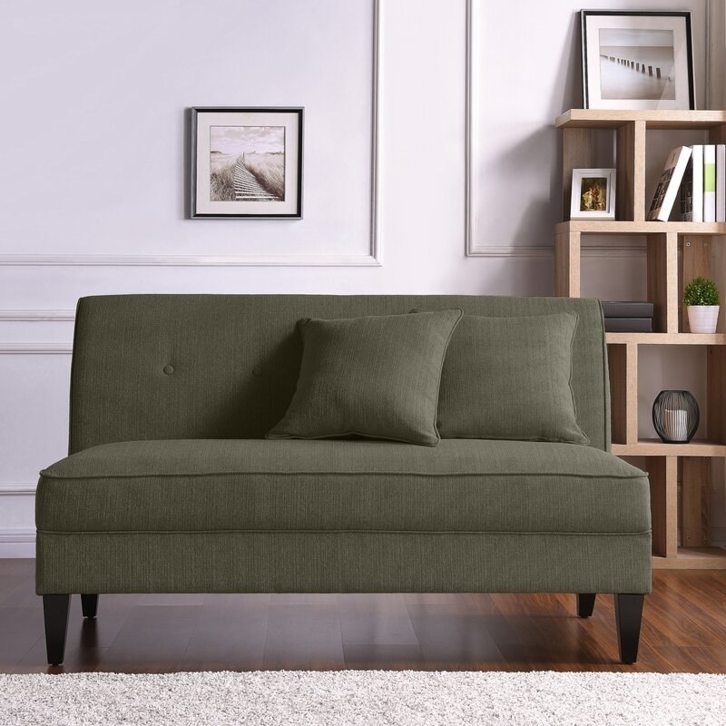 The loveseat comes with two throw pillows. Price: $285.99 (originally $975.10, available in 13 colors)