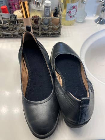 Black vegan leather slip-on shoes with insoles