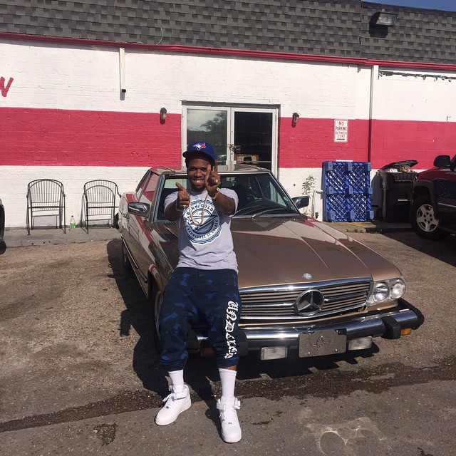 Currensy wearing the Nike Air Force 1 Mid
