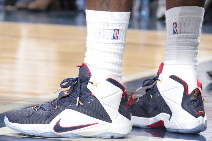 LeBron James wearing Nike LeBron 12 Navy/White-Red-Yellow PE (6)