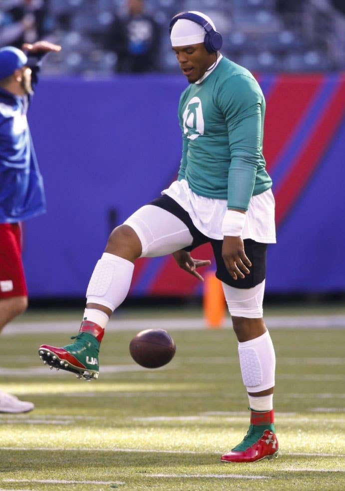 Cam Newton wearing Christmas Under Armour Cleats (2)