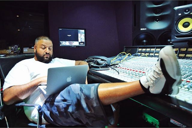 DJ Khaled wearing the White/Black Air Jordan 11 Low IE