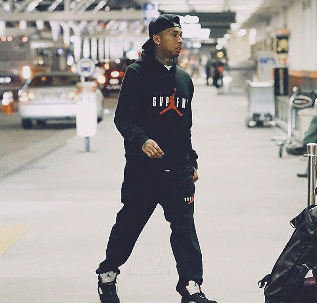 Tyga wearing the &#x27;Black&#x27; Supreme x Air Jordan 5