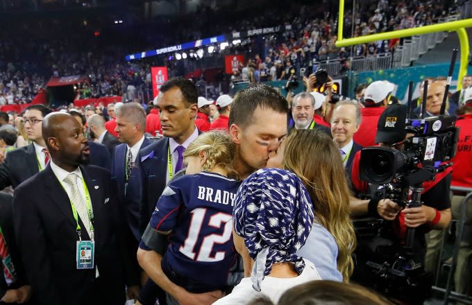 Tom Brady and Gisele Bundchen kiss after Super Bowl 51.