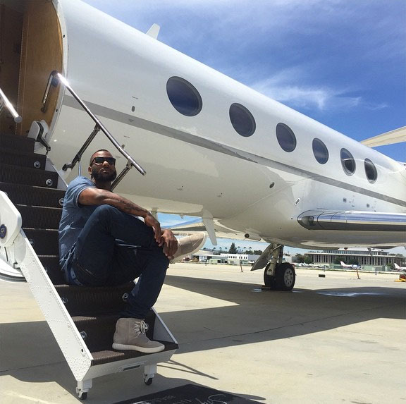 The Game wearing adidas Yeezy 750 Boost