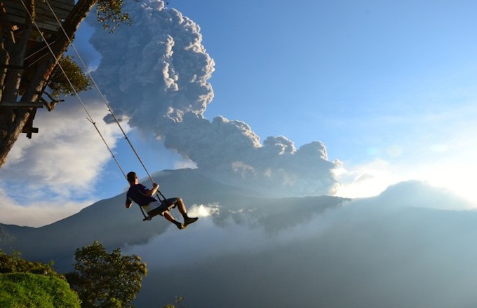 A Person on a Swing with Ecuador&#x27;s Mt. Tungurahua Shot by  Sean Hacker Teper 
