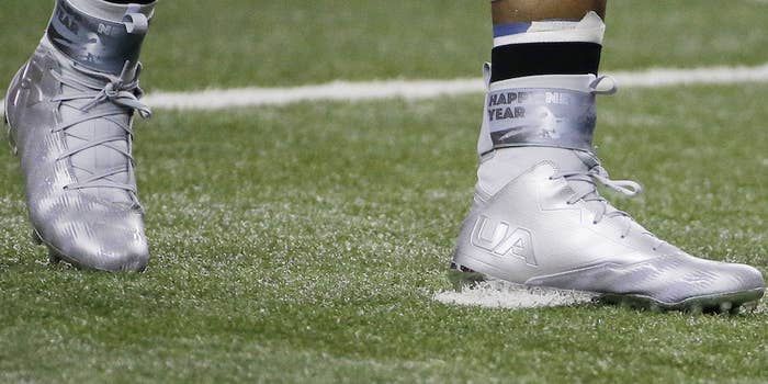 Cam Newton wearing Happy New Year Under Armour Cleats (1)
