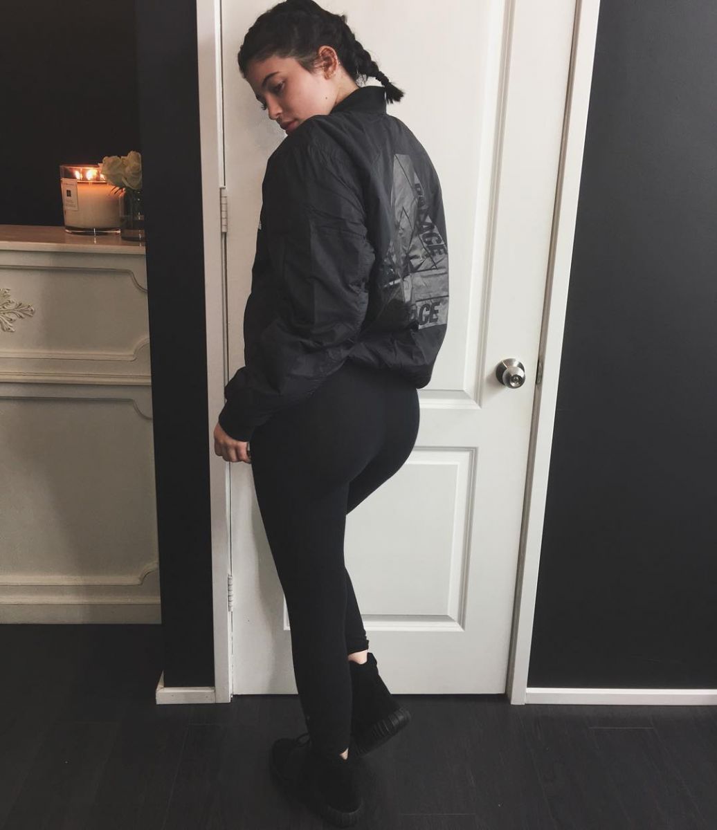 Kylie Jenner wearing the &#x27;Core Black&#x27; adidas Yeezy 750 Boost