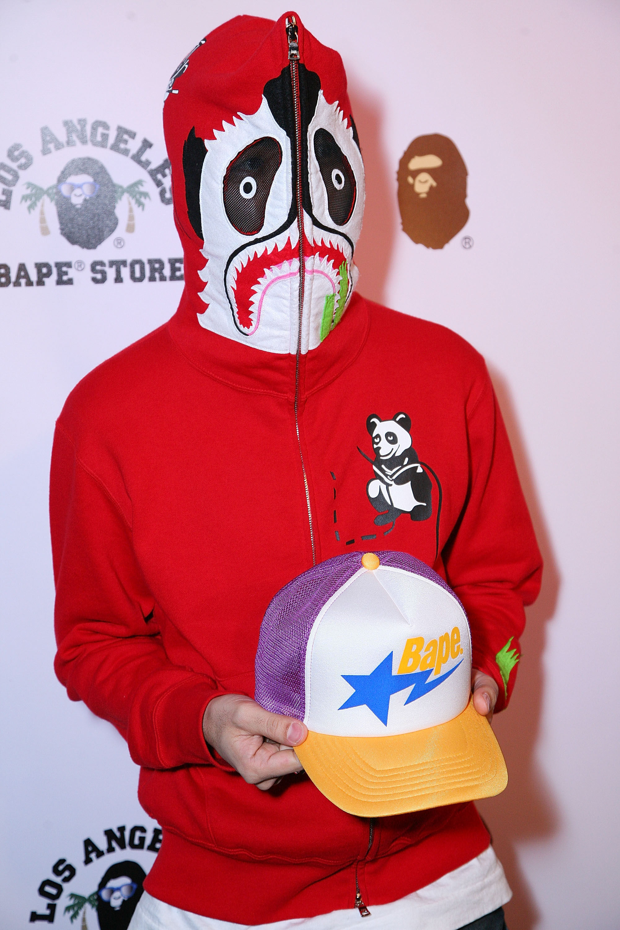 Nigo arrives at the BAPE store opening on Melrose Avenue.