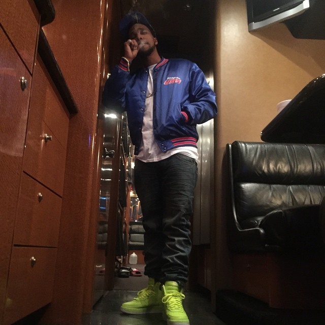 Currensy wearing the &#x27;Volt&#x27; Nike Air Force 1 High Hyperfuse