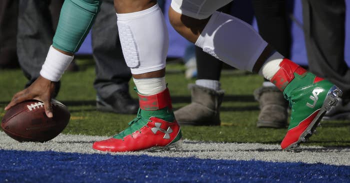 Cam Newton wearing Christmas Under Armour Cleats (1)