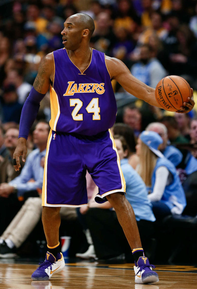 Kobe Bryant Wearing a Purple/White-Yellow Nike Kobe 11 PE (1)