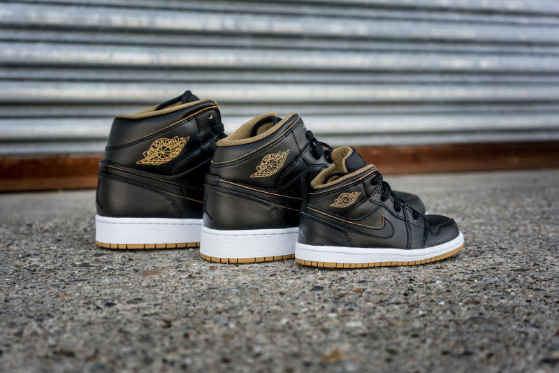 Black jordans sales with gold trim