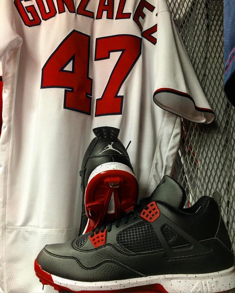 Gio Gonzalez Wearing Black/White-Red Air Jordan 4 Cleats (3)