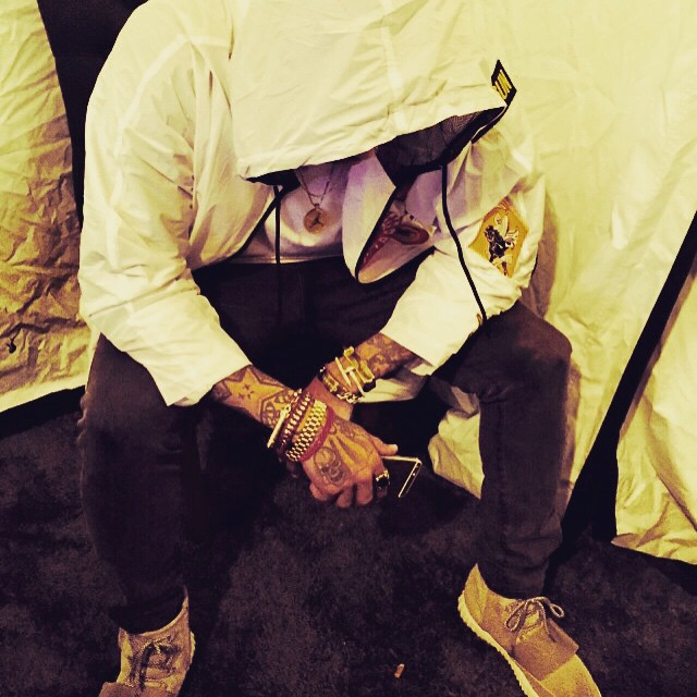 Chris Brown wearing adidas Yeezy 750 Boost