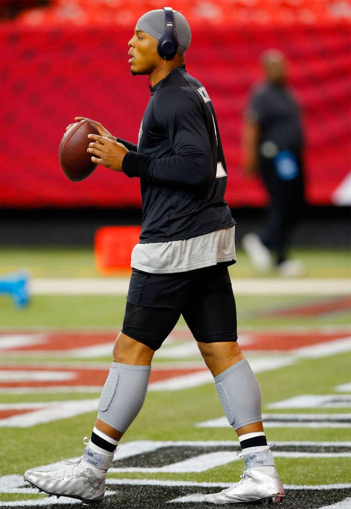 Cam Newton wearing Happy New Year Under Armour Cleats (2)
