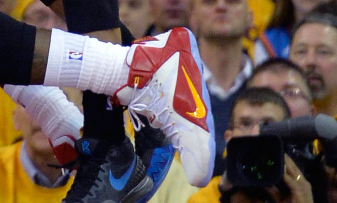 LeBron James wearing Nike LeBron XII 12 White/Red-Yellow PE on January 25, 2015