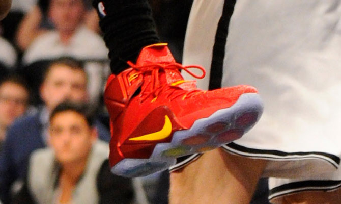 LeBron James wearing Nike LeBron XII 12 Red/Yellow PE on December 8, 2014