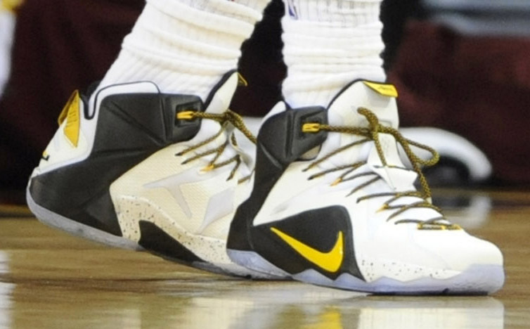 LeBron James wearing Nike LeBron XII 12 White/Black-Yellow PE on December 28, 2014