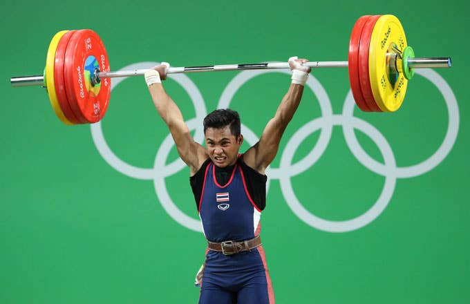 Sinphet Kruithong competes during the 56 kg weightlifting event.