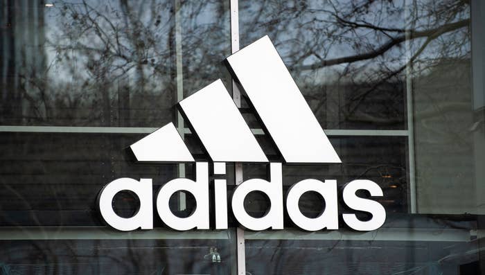 The company&#x27;s logo hangs on the façade of the Adidas store