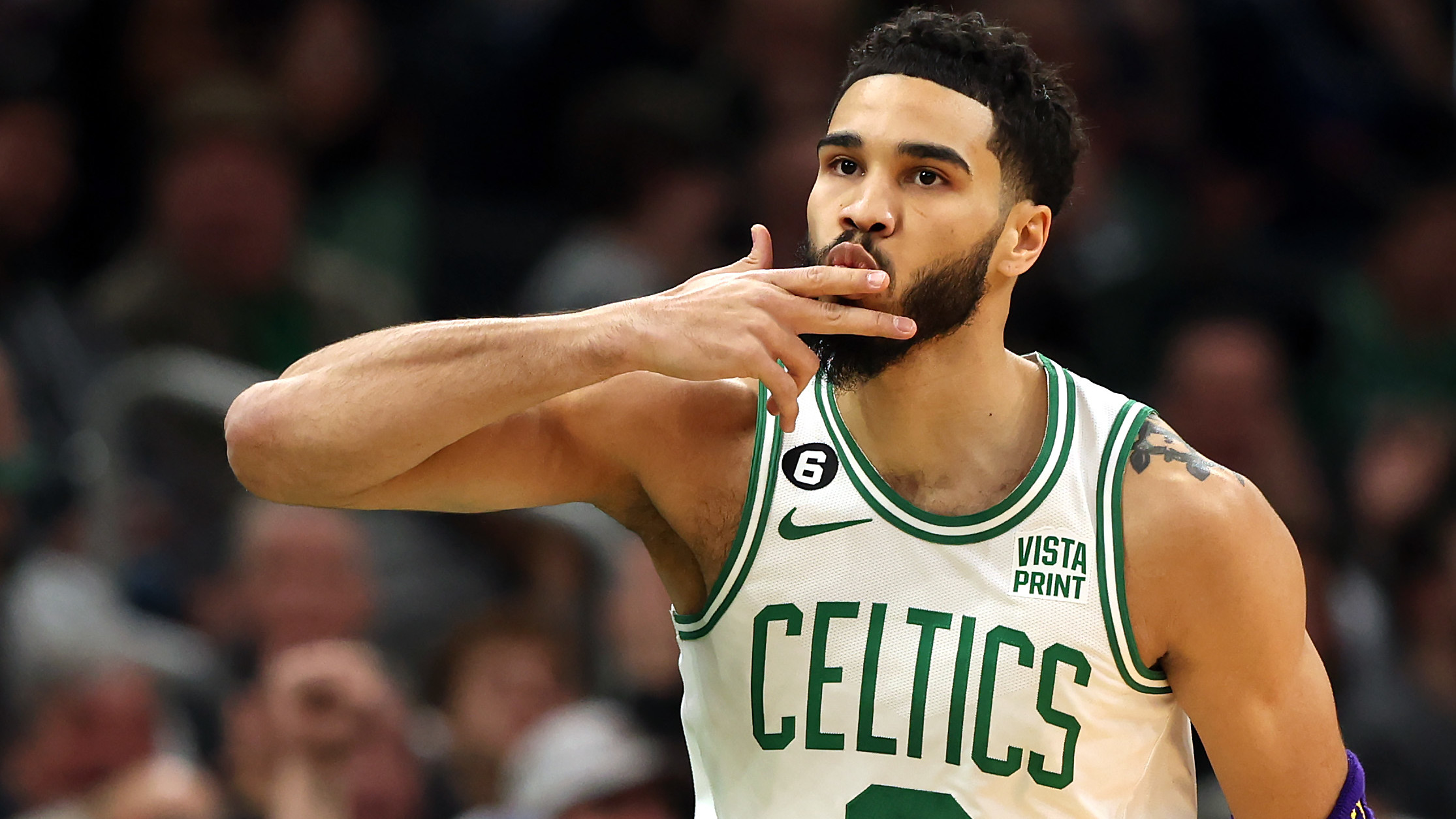 Jayson Tatum of the Boston Celtics celebrates after hitting a three point shot against the New York Knicks