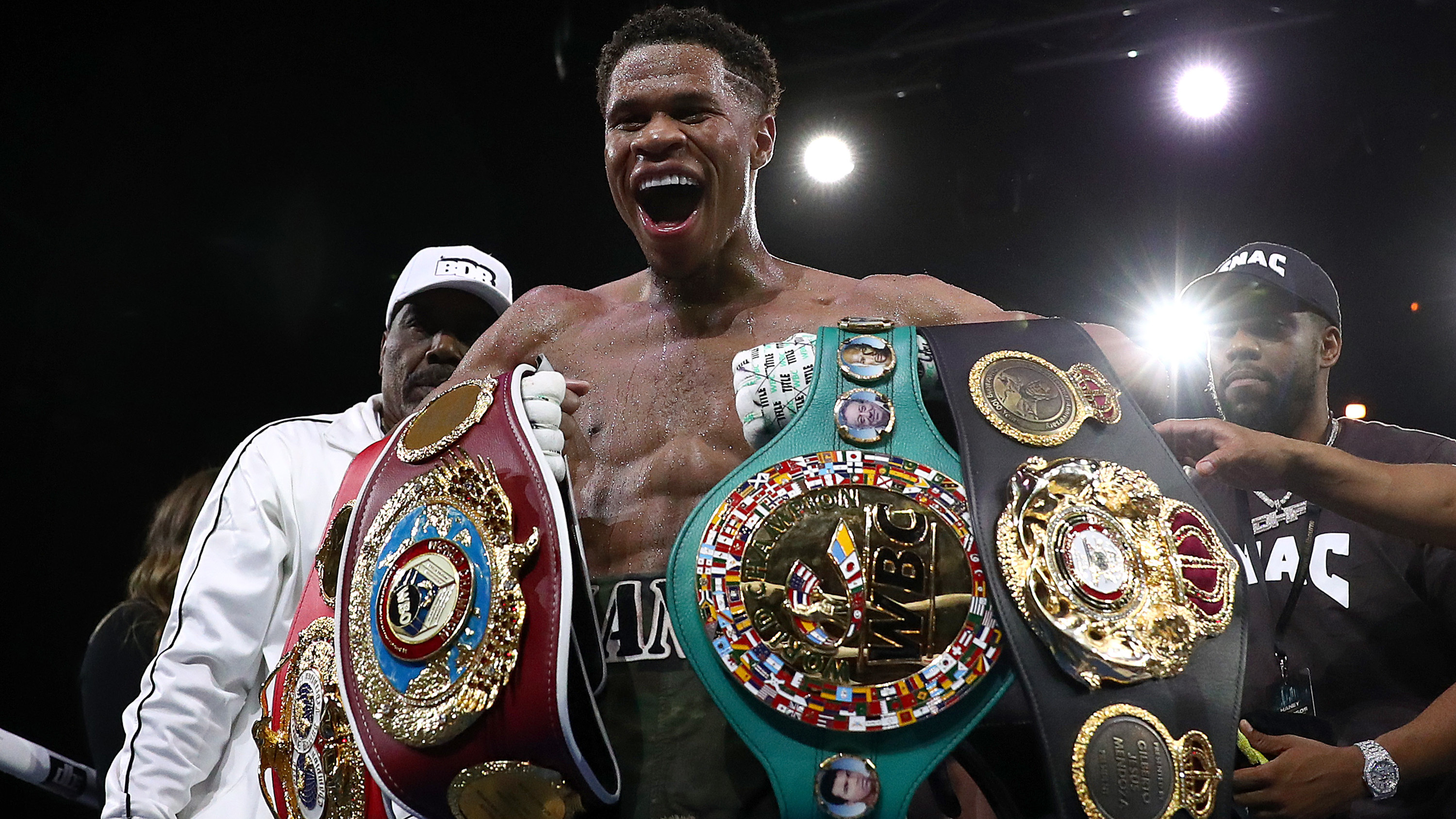 Devin Haney celebrates victory over George Kambosos