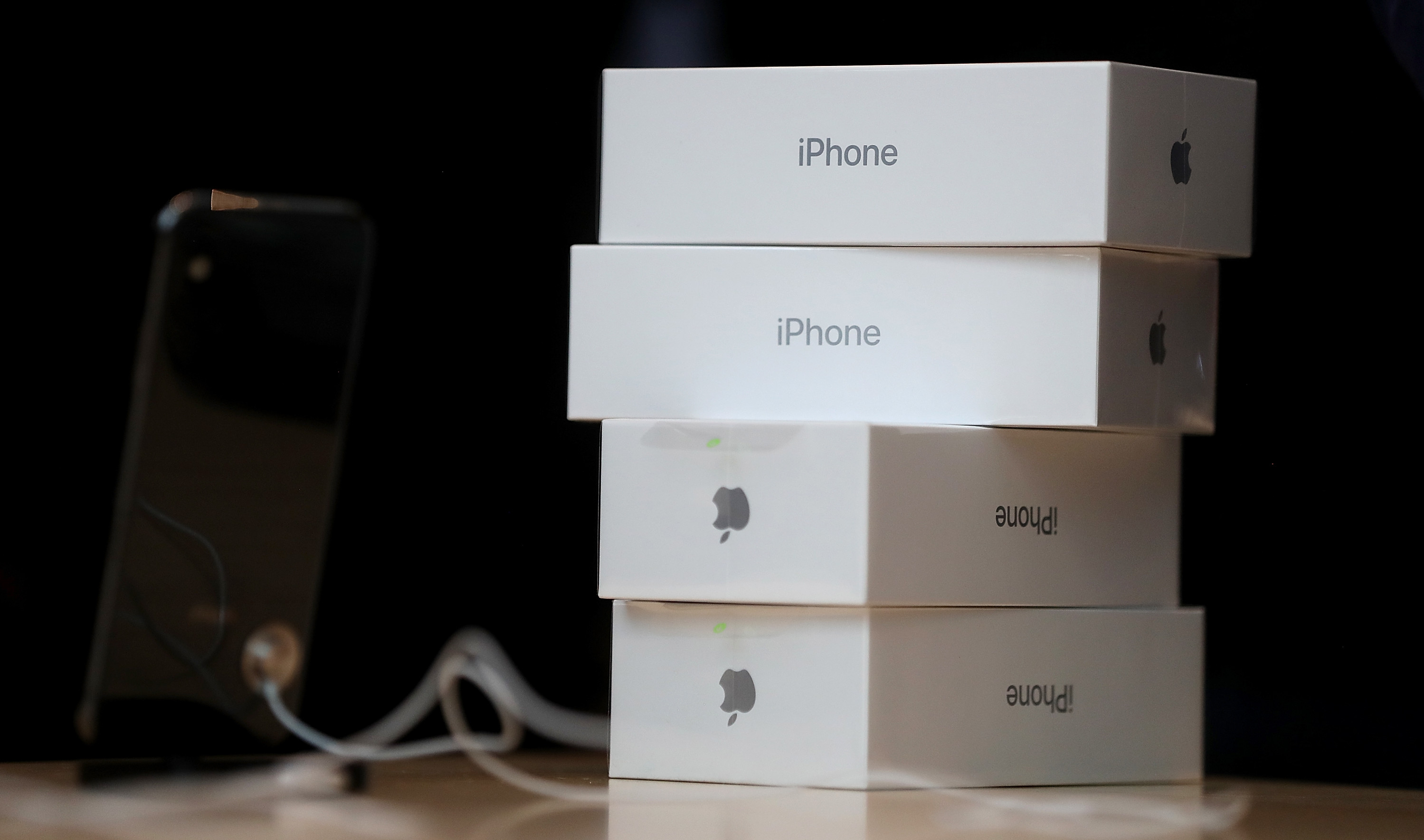 Boxes of the new iPhone X sit on a table at an Apple Store