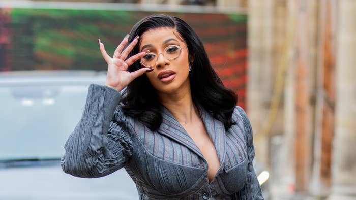 Cardi B wears glasses and a skirt suit in Paris.