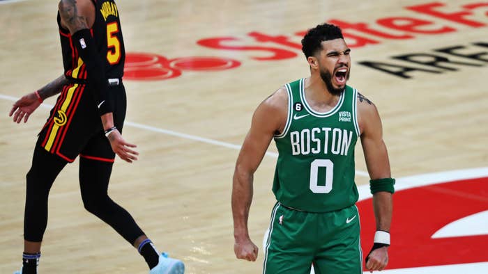 Jayson Tatum of the Boston Celtics celebrates after hitting a three point shot