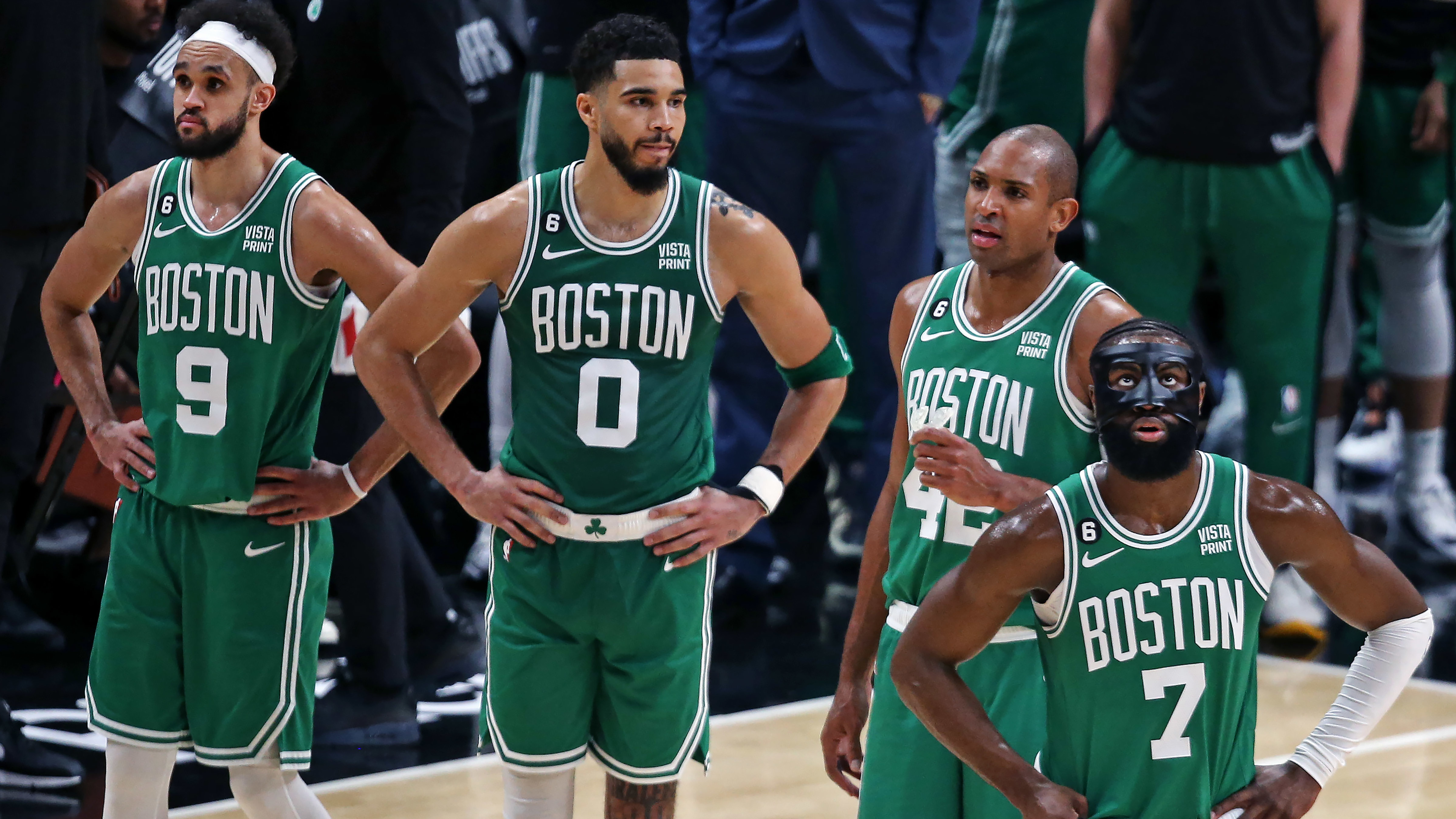 errick White, Jayson Tatum, Al Horford and Jaylen Brown stand on the court in the final moments of the fourth quarter