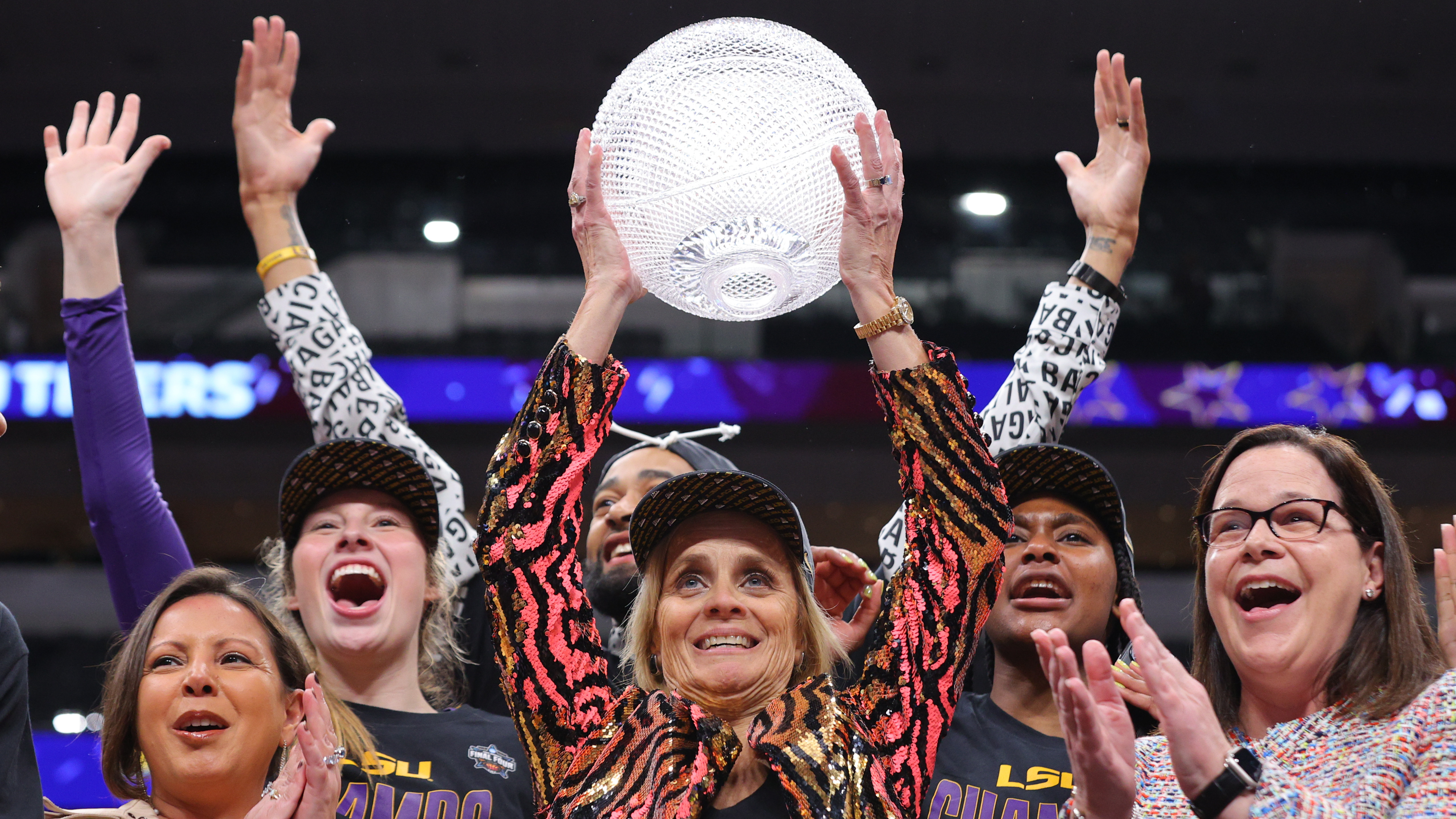 LSU women&#x27;s basketball national championship raising trophy