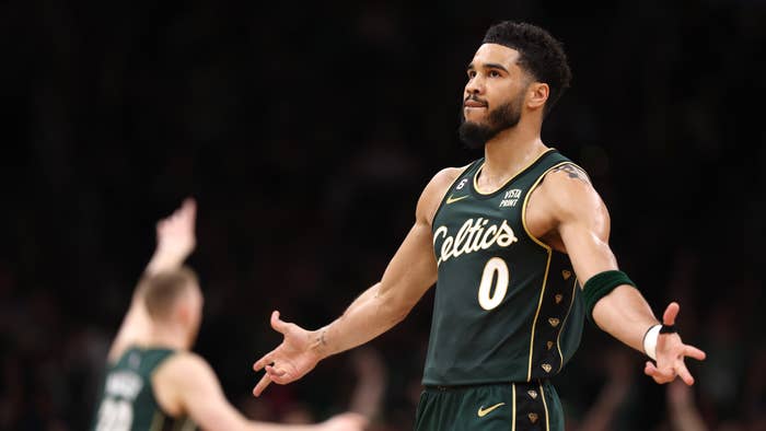 Jayson Tatum of the Boston Celtics celebrates after hitting a three point shot