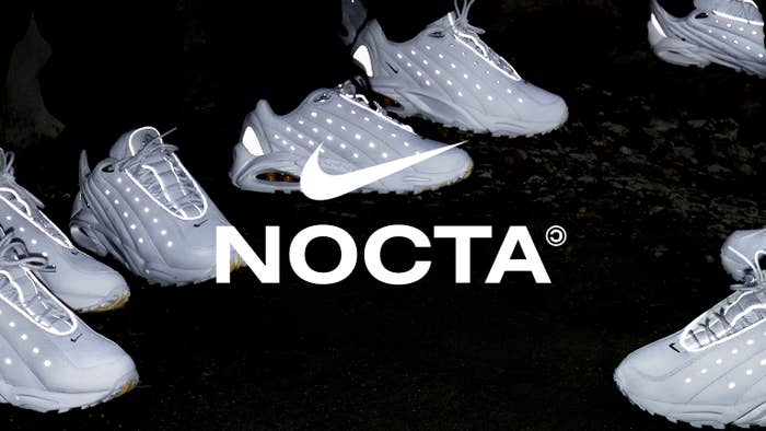 The triple-white Nike Nocta Hot Step sneakers from Drake on feet