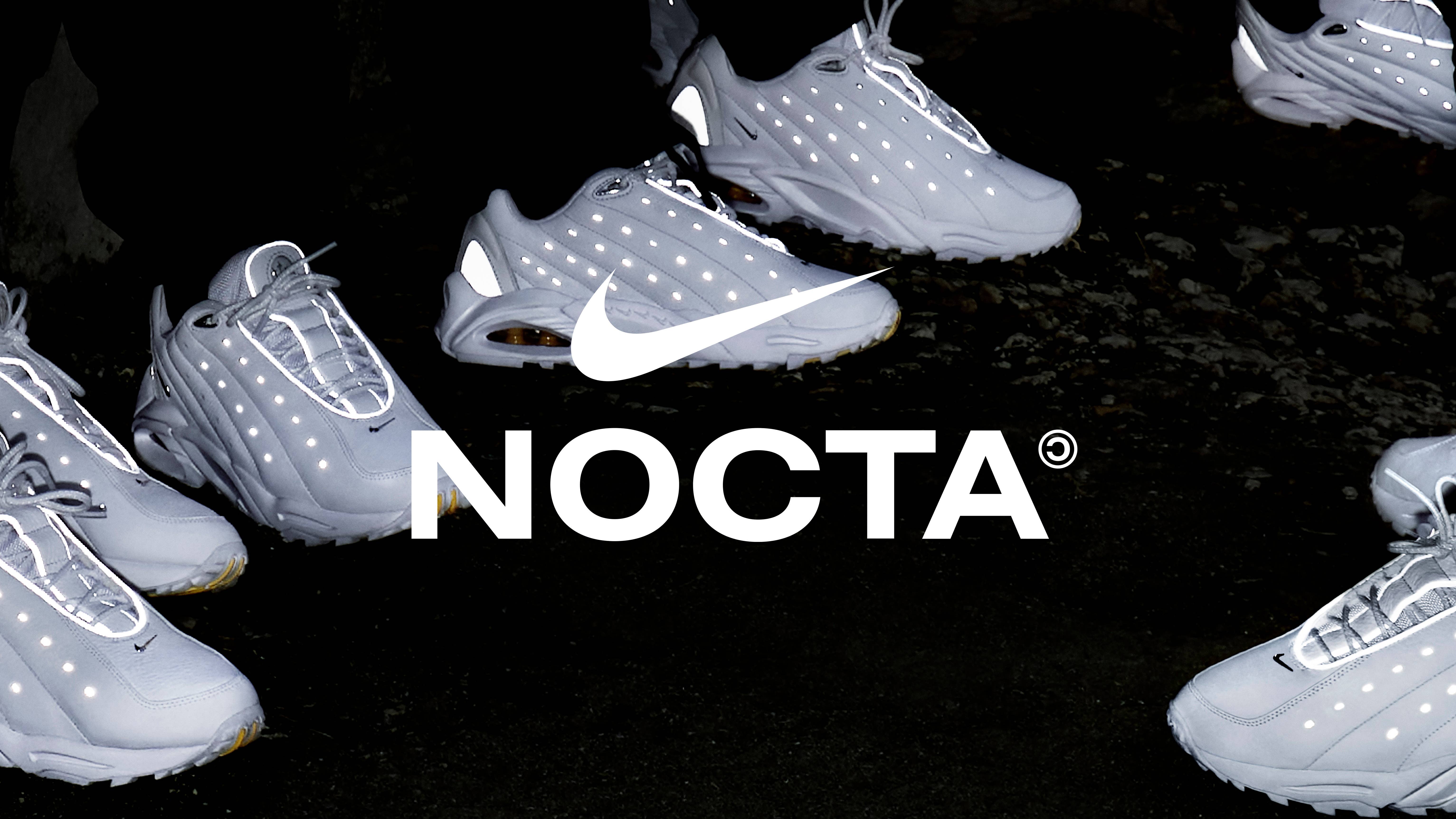 The triple-white Nike Nocta Hot Step sneakers from Drake on feet