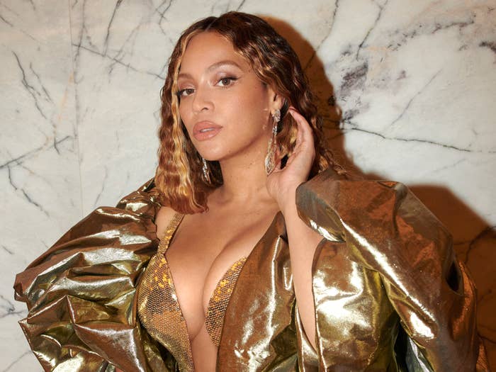 Beyoncé in a gold dress at the opening of the Atlantis The Royal Grand resort.