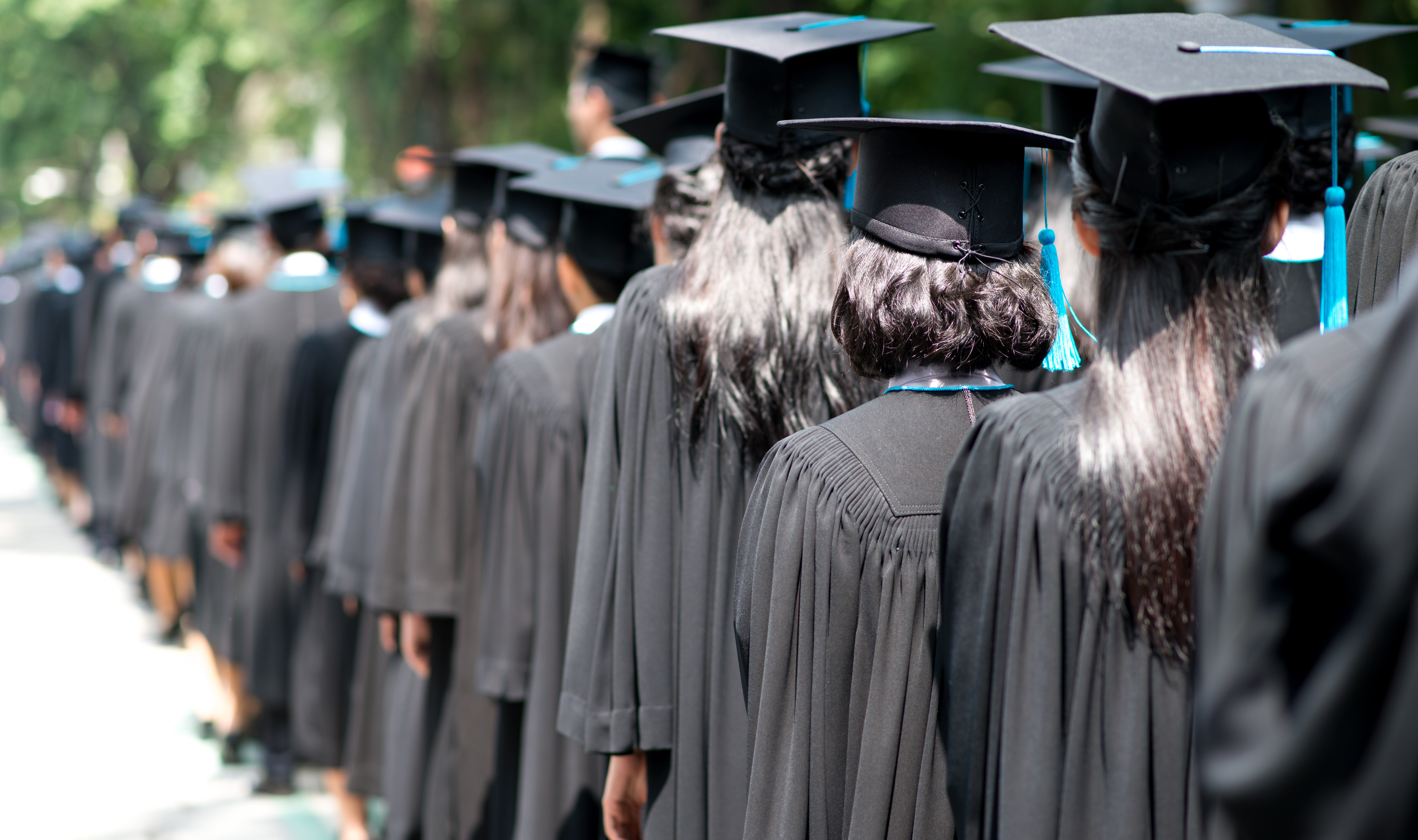 A look at a row of graduating college students