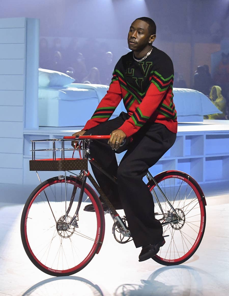 Tyler, the Creator riding through Louis Vuitton fashion show on a