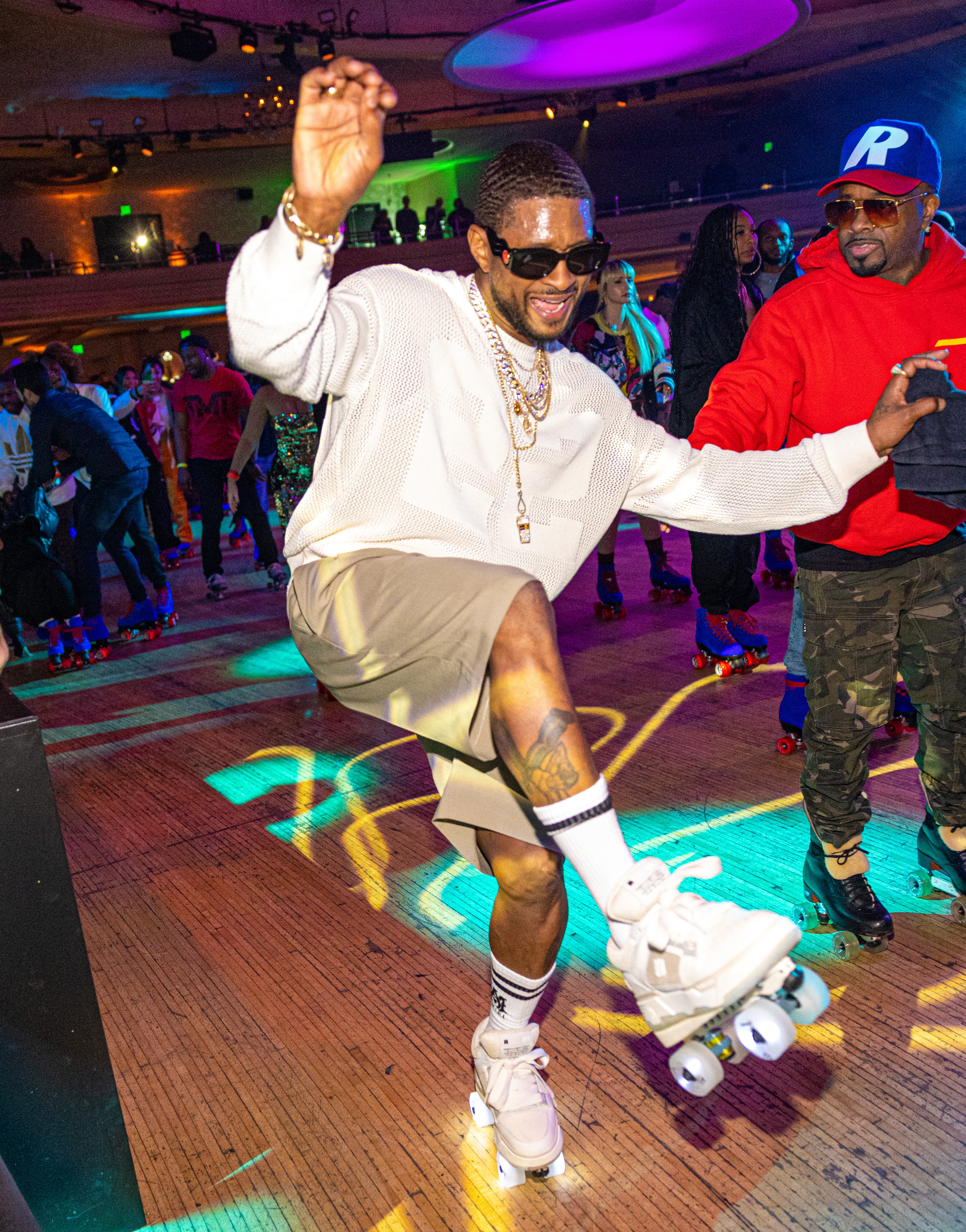 Usher skating at the Interscope Grammys party