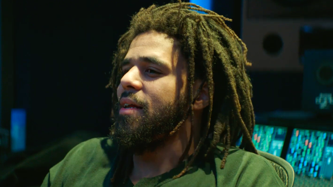 Man with black beard, J. Cole Holding Face, music stars, j. cole