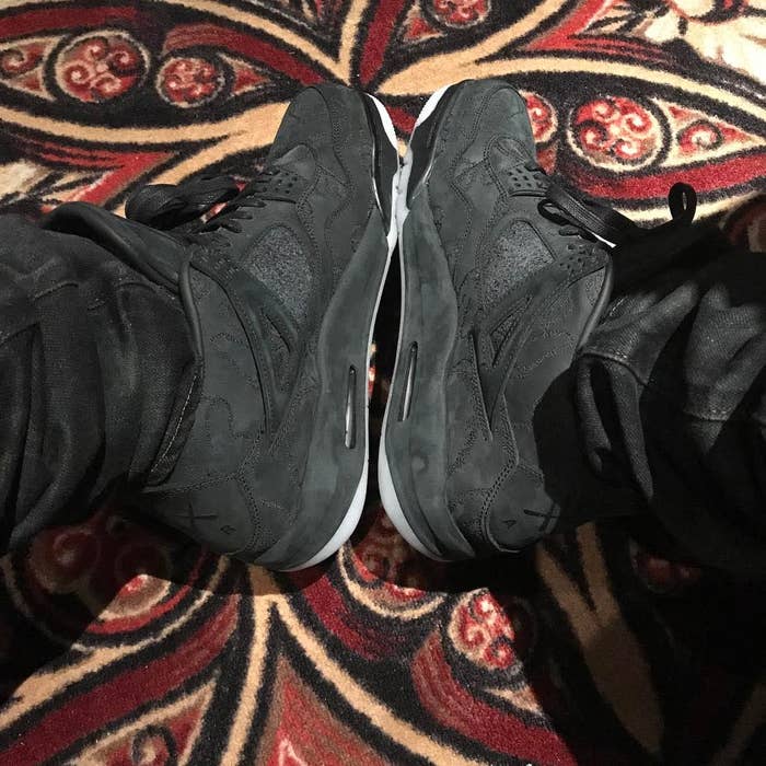Drake Kaws Air Jordan 4 Black On-Foot