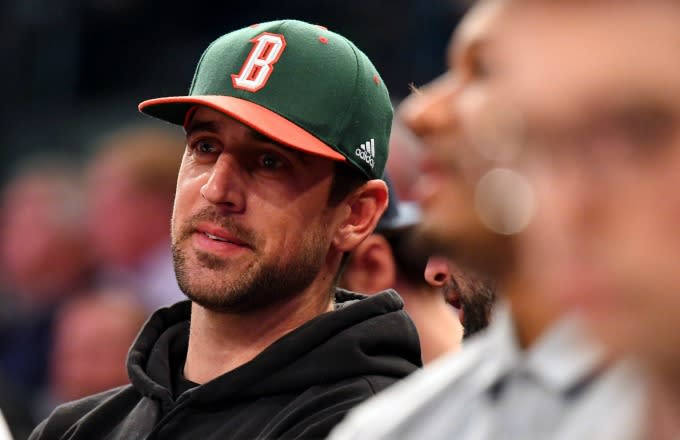 Aaron Rodgers watches a Bucks game.