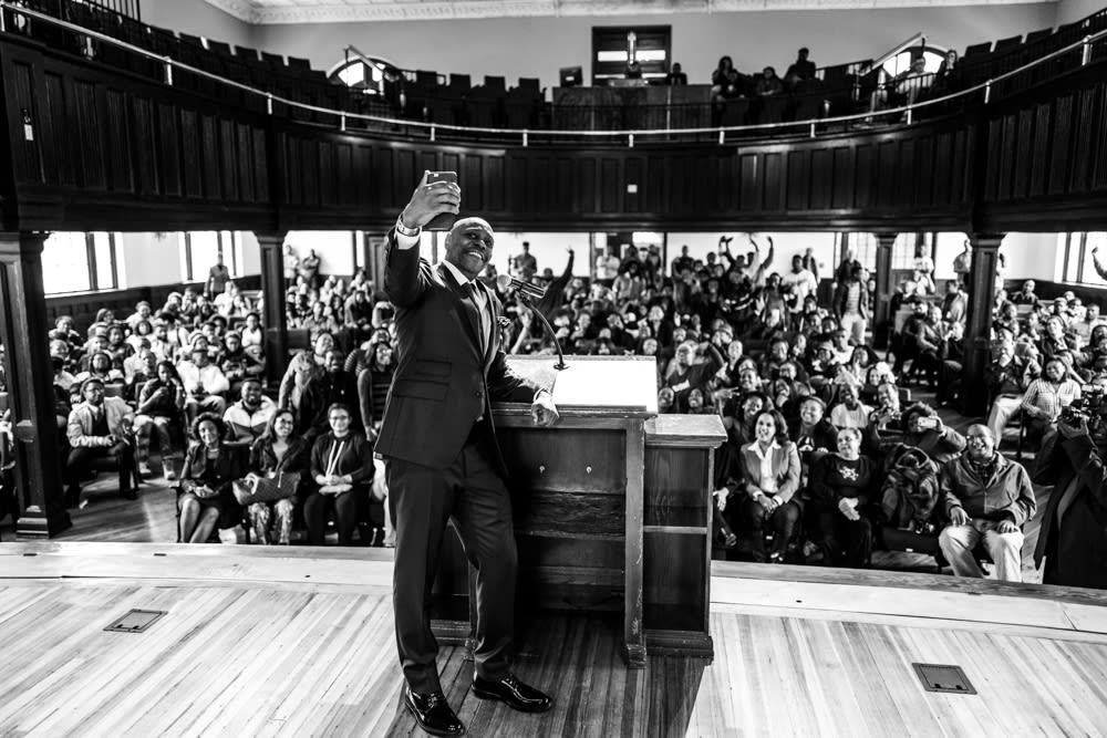 Dave Chappelle taking a selfie with the congregation of Chappelle Memorial A.M.E. Church
