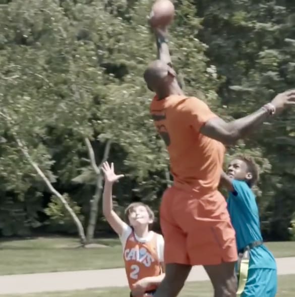 lebron playing football against little kids