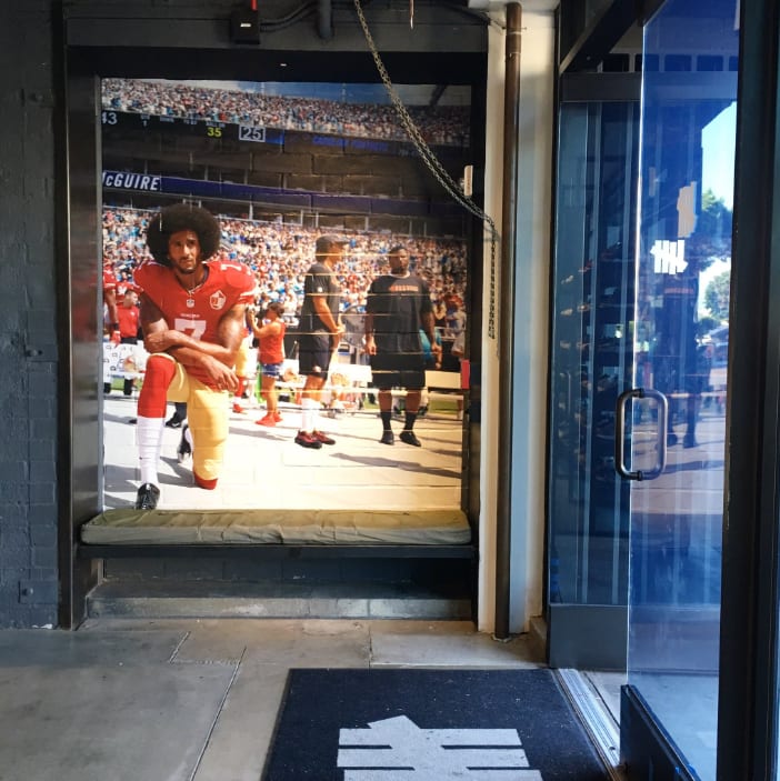 A mural of Colin Kaepernick kneeling during the National Anthem at Undefeated&#x27;s L.A. store.
