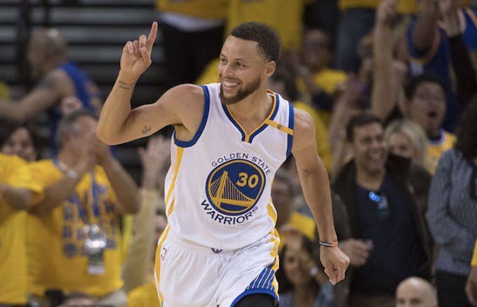 Steph Curry acknowledges teammate on the court.
